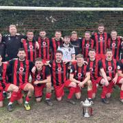Sturminster Newton United celebrate their title win after beating Holt United 2-0