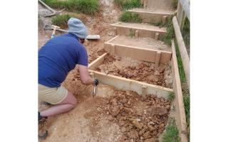 Rangers carrying out maintenance work on steps on Lulworth estate