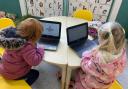 Pupils at the Prince of Wales School in Dorchester using laptops during class