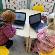 Pupils at the Prince of Wales School in Dorchester using laptops during class