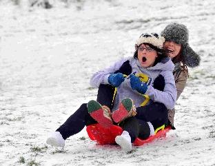 Enjoying the snow at Maumbury Rings in Dorchester are Hannah Coombes and Hattie Wilson.
