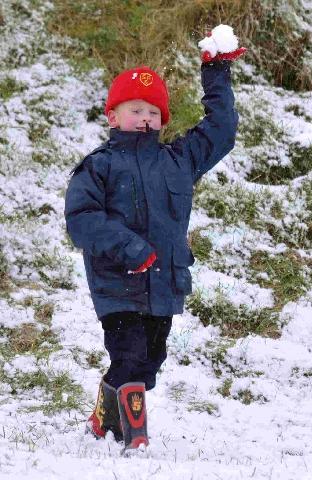 Enjoying the snow at Maumbury Rings in Dorchester is George Livsey.