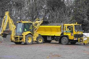A gritter being being refilled at Grimstone Depot.