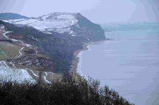 Snowy Golden Cap viewed from Charmouth. January 2010.