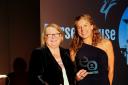 Lyn Martin accepting the award from Rosemary Shrager Picture: EVIIVO AWARDS