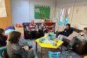 Volunteers at Home-Start enjoy a tea break on a training course