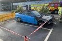 Convertible catches fire in supermarket car park