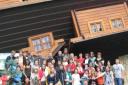 The group outside the upside down house at a leisure park based on wood production, near Gdansk, Poland