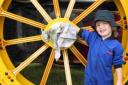 Isaac Jacobs, three, from Derby, spruces up a wheel