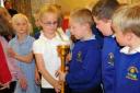 LOOK AT  THIS: The torch is examined at Bincombe Valley Primary School