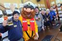 CHEERS THEN: Rick Gape of Camra, the RNLI mascot, deputy bar manager Phil Livesy, Rob Martin of the Piddle Brewery, former Dorchester mayor Tess James and Beerex chairman Ben King at last year’s event