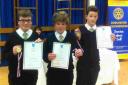 VOICES OF A GENERATION: JJ Gale, Sam Robinson and Zac Withers from Beaminster School with their medals and certificates