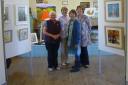 (from L) Dot Emblen, Pat Dawson-Harris, Judy Backwell and Maureen Morris with just some of the pictures on display