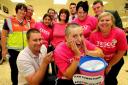 Tesco worker Bobbie White has her head shaved by hubby Scott to raise money for Race for Life