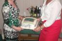 Mrs. Meryl Hodder and Mrs. Christine Wells with the anniversary cake