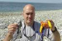 DEBRIS: Steve Trewhella with balloons he has picked up over the years from Dorset beaches