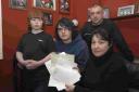 LOST IN THE POST: Carole Potter, right, with Max Brumble, Lee Potter and Eugene Potter with letters from other complainants