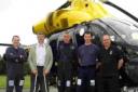 QUICK ACTIONS: Adrian Lessey, second left, is reunited with pilot Tom Martin, PC Nigel Davies, PC Eric Lundon and road policing officer Nigel Scott 