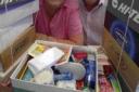 Shoebox appeal: Coun Molly Rennie and husband John with some of the boxes	Picture: FINNBARR WEBSTER/F6997