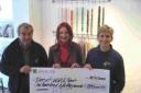 CASH TO HELP WILDLIFE: From left, Dorset Wildlife Trust’s Giles Harbottle, Andrea Frankham-Hughes of Jezebel’s Jewels and the trust’s Nicky Hoar