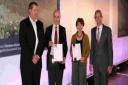 HONOUR: Patrick Charlton and Rosalyn Guard of Environs Partnership receive awards from Nick Crane, right