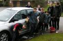 members of the Crossways youth forum wash their first car of the morning