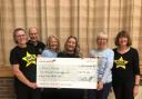 n Stacey Hobday, the Rock Choir leader, together with Sue and Alan Pike, Trudi Baker and Jane Evans from the Choirs and Gill Slade from the Dorchester Friends of Julia’s House