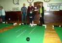 Members of the Southill Short Mat Bowls Club in action. Jean Turner is bowling, with (left to right) Ray  Hunter, Brian Moore and Teresa Dalkins.