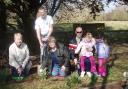 Wendy Bennett, Dave Price, Sophie and Abbie, Andy Loveless and Fran Davies plant snowdrops and bluebells in the park.