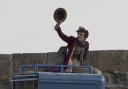 Wonka star Timothee Chalamet raises his hat during filming of the movie in Lyme Regis Picture: Daryl Turner