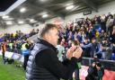 Bobby Wilkinson applauds Weymouth's travelling support after the FA Cup exit at AFC Wimbledon