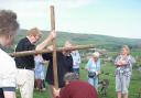 Villagers plant the Cross on Chapel Hill