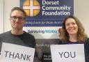 Dorset Community Foundation development manager Gareth Owens and grants manager Ellie Maguire with a message for donors