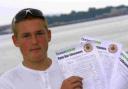 Sailor Adam Greaves with the Save Our Lifesavers petition