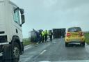A car and a caravan overturned on the A35