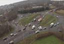 Severe disruption on major road after car and motorbike crash