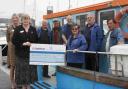 THANKS A LOT: Representatives of Highclere House present £500 to the Friends of MV Freedom