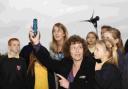GREEN AWARD: Kate Hall, with Southwell Primary School deputy head Claire Taylor and pupils in front of the school’s wind turbine