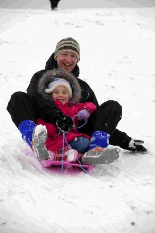 Snow - Mario and Amelia Ambrico having fun on a sledge - 021210, Picture GRAHAM HUNT HG7704