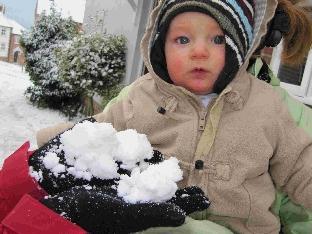 Eight-and-a-half-month old Keiron (corr) Scott sees snow for the first time 

