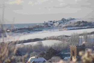 Looking towards St Mary's Church and West Bay by Paul Bennett