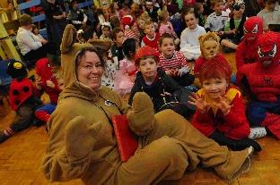 Bridport's St Catherine's Primary School headteacher Frances Guppy with children in costume. 
