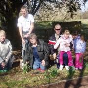 Wendy Bennett, Dave Price, Sophie and Abbie, Andy Loveless and Fran Davies plant snowdrops and bluebells in the park.