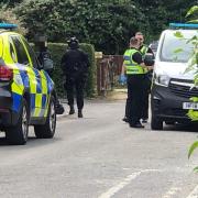 Police officers, including armed officers, on Howard Close, Weymouth. Picture: Josie Klein/Dorset Echo