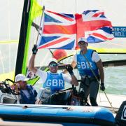 Portland's Stuart Bithell, left, and Dylan Fletcher celebrate their Olympic gold at Tokyo 2020 Picture: SAILING ENERGY/WORLD SAILING