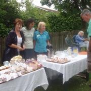 Pictured from left to right - Dreen Meadows, Sue D'Agostino and Mary Wood selling cakes and coffee