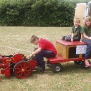 Ryan, Rea and Ethan Casey aboard their dad's three-inch scale steam engine.