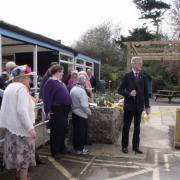 High Sheriff Hon TJ Palmer cuts the ribbon and declares the Crossroads Day Centre Garden open