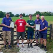 West Dorset CAMRA Chairman Bruce Mead (centre left) and CAMRA brewery liaison officer Dave Harris (far right) present the awards to Victor Irvine and Danny England.