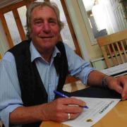 Weymouth and Portland Mayor Graham Winter signs the Echo petition